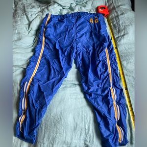 Used does not have drawstring marks around the pants and a tiny rip on the front